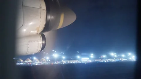 Window view from airplane taking off at night in Philippines Stock Footage 325420716
