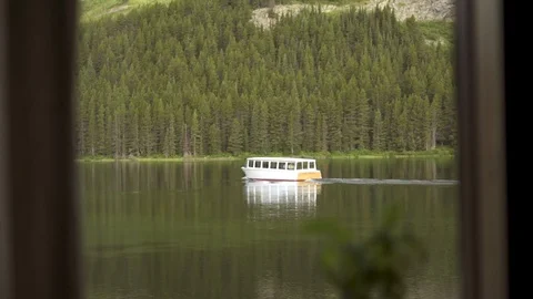 Window View of Boat Driving on Calm Lake, HD 動画素材 129607458