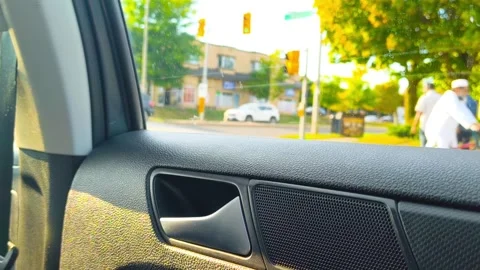 Window view from a car driving through the city on a bright day, capturing the Stockbeeldmateriaal 318310852