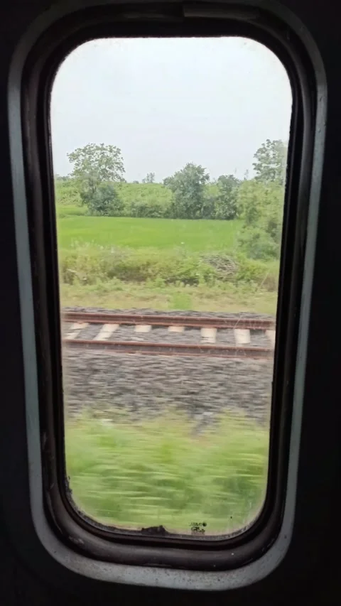 A window view from a fast running trains during day time Stock Footage 217685433
