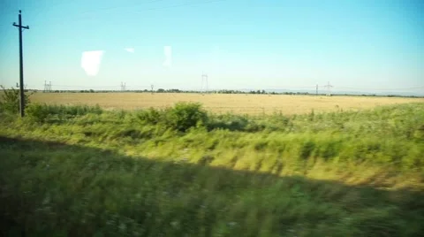 Window view on the fields from a train. Stock-Footage 64895056
