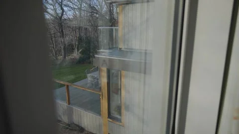 A window view of a house with a balcony Video stock 302441806