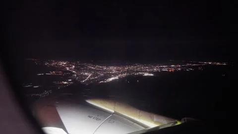 Window view of inside airplane at right wing at night Stock-Footage 325173797