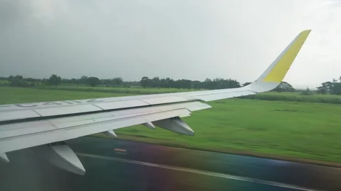 Window view of inside flying airplane taking off Stock Footage 325173272