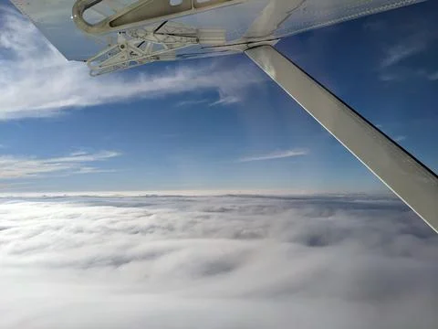 Window view from light general aviation aircraft. Strut and wing of semi-ca.. 写真素材
