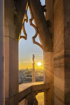 Window view from Milan Cathedral looking at the sunset Stock Photos