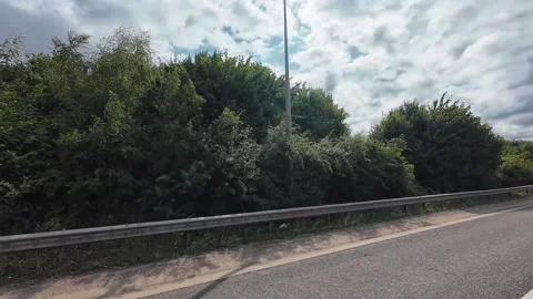 Window View of Motorways and Traffic During Car Travel From Luton to Canterbury Stock Footage 314465652