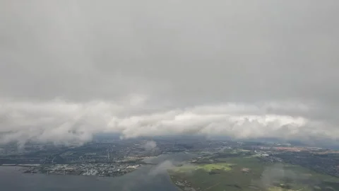 Window view plane going into cloud cover Stock Footage 246942316