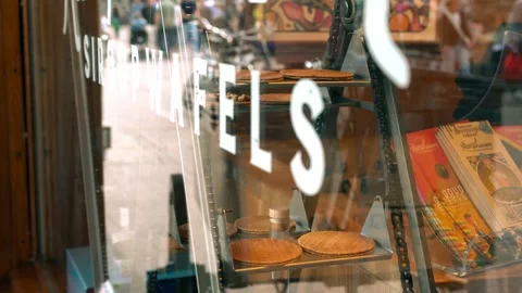 Window View of the process in stroopwaffle making in a shop in Gouda Stock Footage 283498143