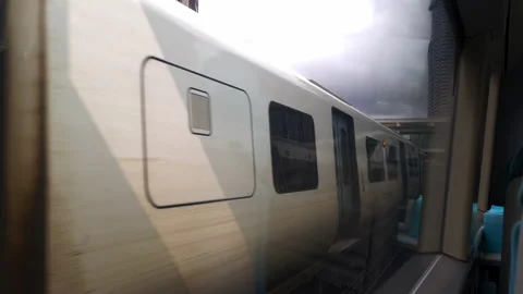 Window view of a railway train pulling into East Croydon train station. Stock Footage 239554069