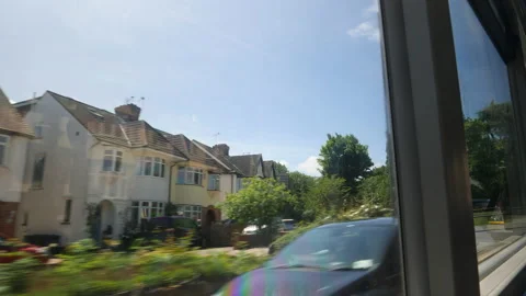 Window view from riding bus of town on outskirts of London, UK. Stock Footage 204099204