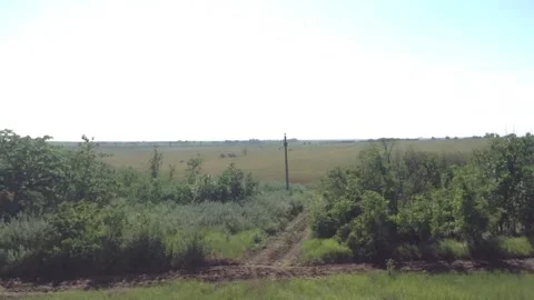 Window view From a running Train with sky , Green grass and trees in Summer Stock Footage 167890869