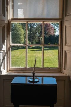 Window view with table and candle Stock Photos