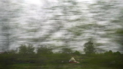 Window View from Train, Car or Bus, in 4K, No Color Correction Stock Footage 89568892