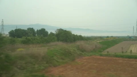 Window View from Train, Car or Bus, in 4K, No Color Correction Stock Footage 90065407