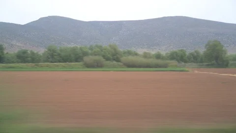 Window View from Train, Car or Bus, in 4K, No Color Correction Stock Footage 90066781