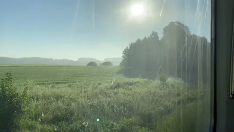 Window view from train going from Klaipeda to Vilnius at sunrise Stock Footage 157214447
