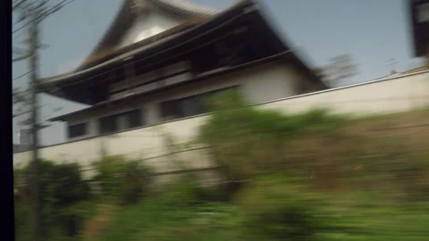 Window view from train to Tokyo: town with traditional and modern houses. Japan. Stock Footage 246709661