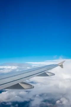 Window view of the wing of an airplane Stock Photos