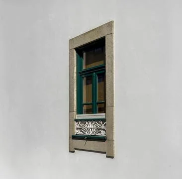 Window on wall. Classic rectangular green frame, decorative iron grille, st.. Stock Photos