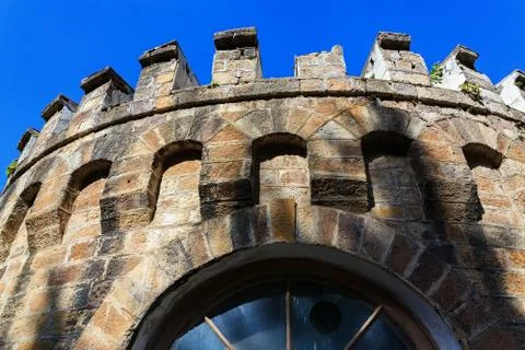 Window in the wall of an old castle. Stock Photos