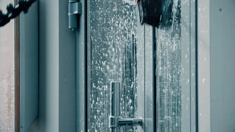Window washer cleaning building facade Stock Footage 103150256