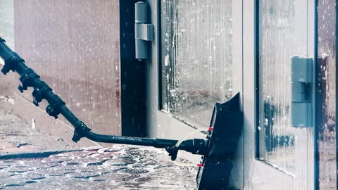 Window washer cleaning building facade Stock Footage 124511168