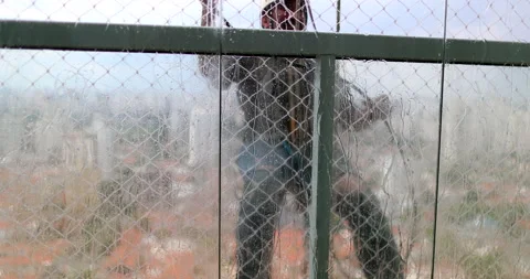 Window washer cleaning building facade. Person cleaning building window Stock Footage 145859735