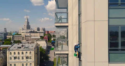 Window Washers on a Office Building. Industrial climber - Facade Cleaning Stock Footage 104500049