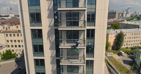 Window Washers on a Office Building. Industrial climber - Facade Cleaning Stock Footage 104500449
