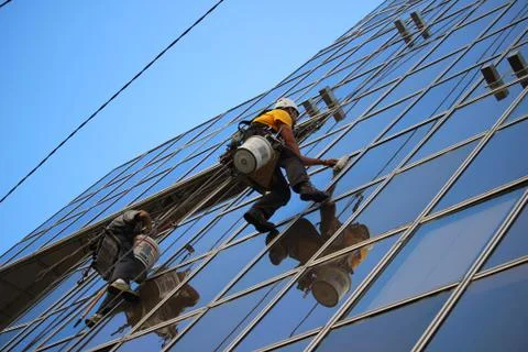 Window washers on the skyscraper Stock Photos