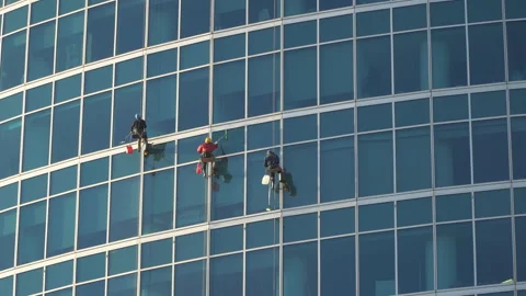 The window washers on the skyscrapers at work, Stock Footage 108436045