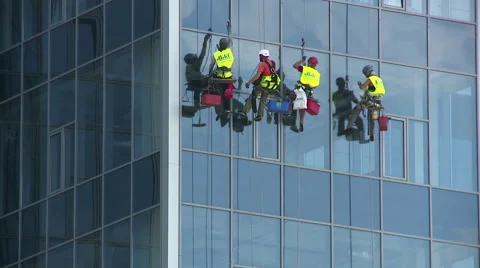 Window washers on the wall of a skyscraper. Stock Footage 40195291