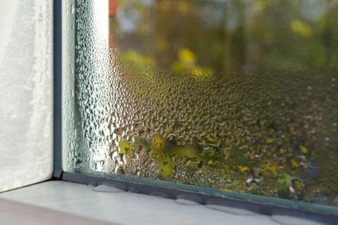 Window with water drops closeup, inside, selective focus Stock Photos