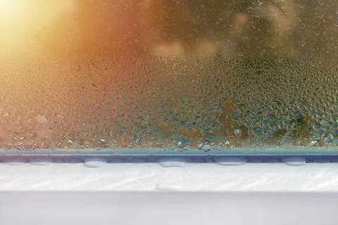 Window with water drops closeup, inside, condensation Foto stock