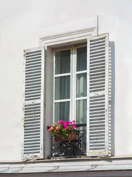 Window on white wall with flowers Stock Photos