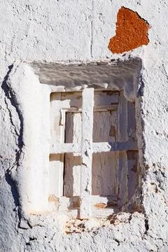 Window in a whitewashed Alhambra facade Stock Photos