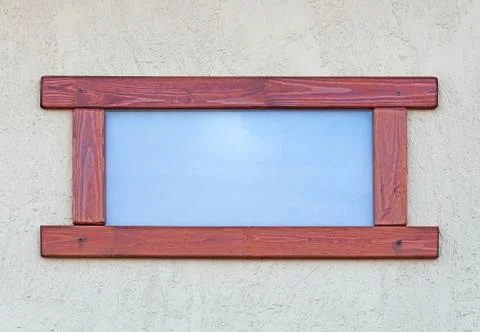 Window in a wooden frame. Stock Photos