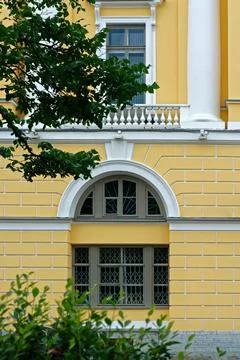 Window on a yellow background. Stock Photos