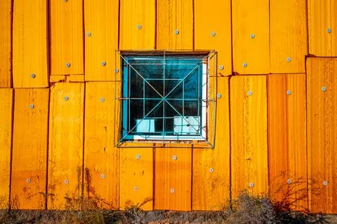 Window in a yellow house Stock Photos
