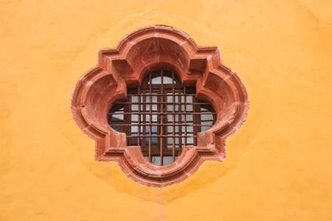 Window on yellow wall Stock Photos