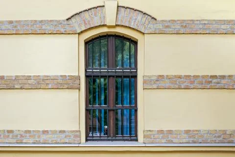 Window on yellow wall. Stock Photos