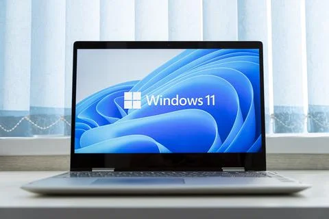 Windows 11 logo on laptop screen. A new operating system update from Microsof Stock Photos