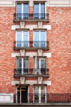 Windows against the red wall. Stock Photos