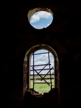 Windows of an ancient temple, in the wall of red brick, in the form of an arc Stock Photos