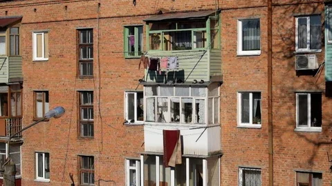 Windows and balconies of the old brick apartment building of the USSR Stock Footage 110605916
