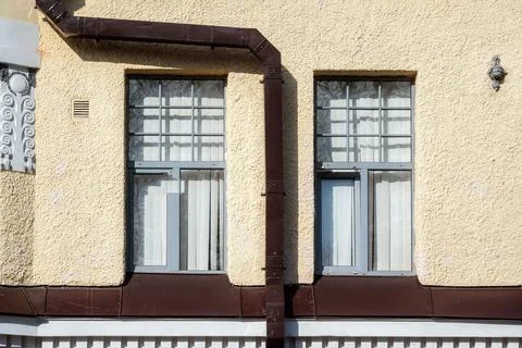 Windows and drainpipe. 스톡 사진