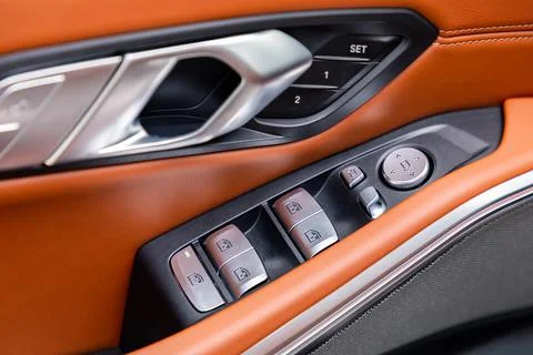 Windows and mirror controller in a car Stock Photos