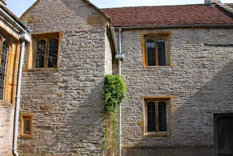 Windows and old stone walling in an English Manor House Stock Photos
