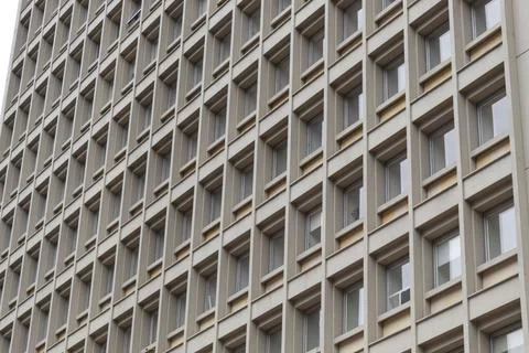 Windows and square patterns of an old skyscraper Stock-Fotos